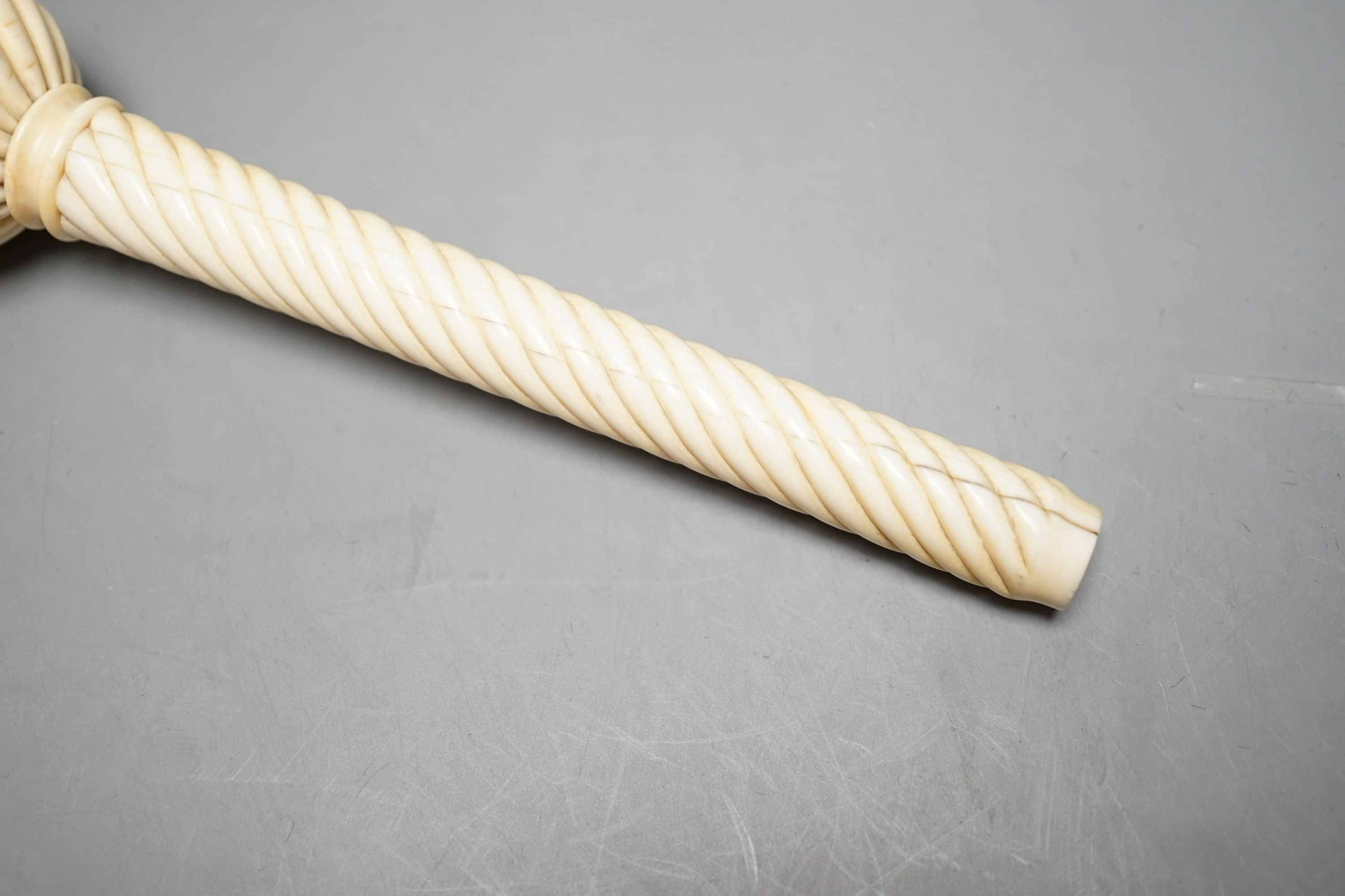 A 19th century Ivory parasol handle, 17 cms long.